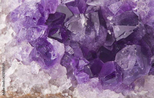 Macro structure of natural violet amethyst gem stone crystals texture