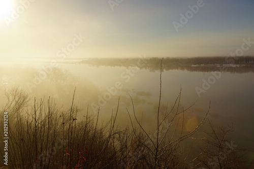 morning spring fog over the river rises the sun is melting snow beautiful scenery