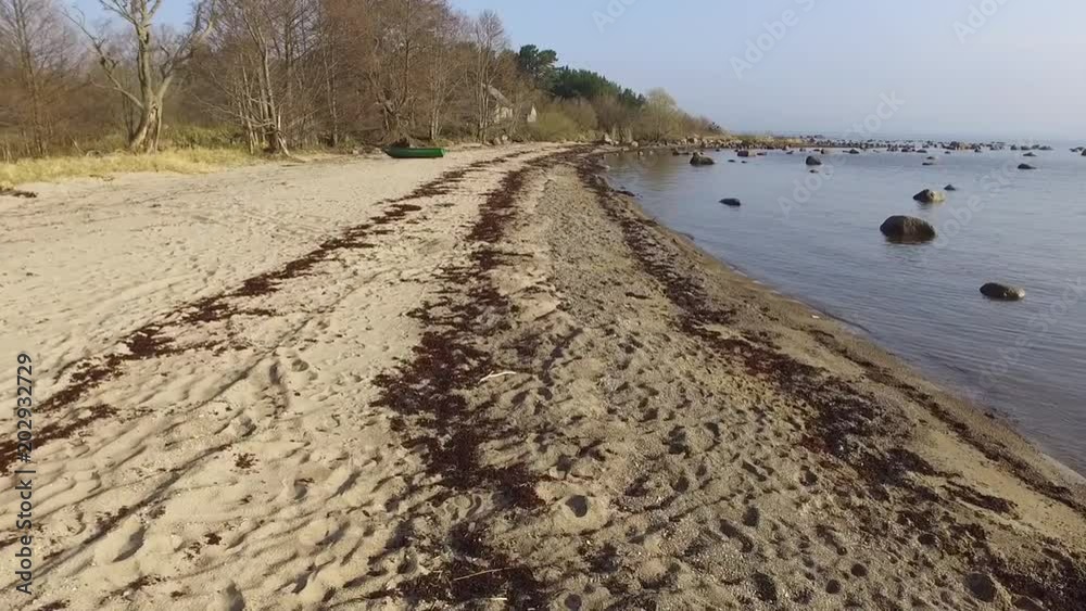 Latvian countryside in spring, beautiful stone coastline in Roja, drone footage Latvian countryside in spring, beautiful stone coastline in Roja, drone footage