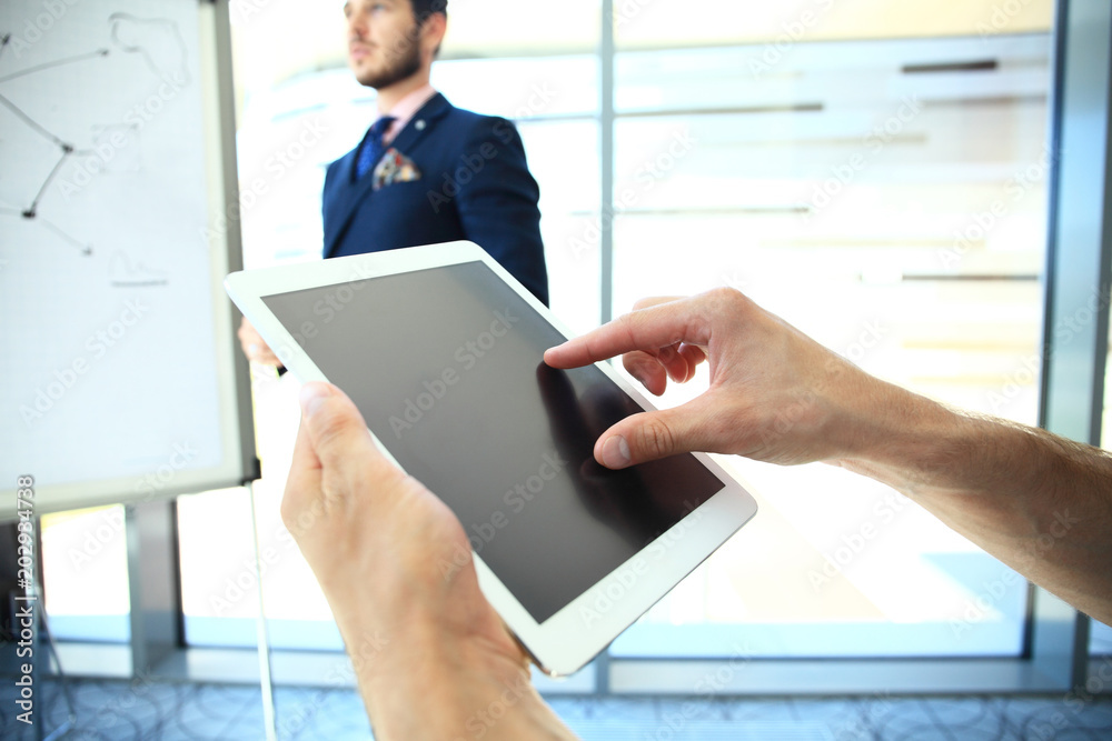 Business adviser analyzing financial figures denoting the progress in the work of the company. Business adviser analyzing financial figures denoting the progress in the work of the company.