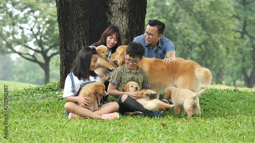 Asian family with puppy dog