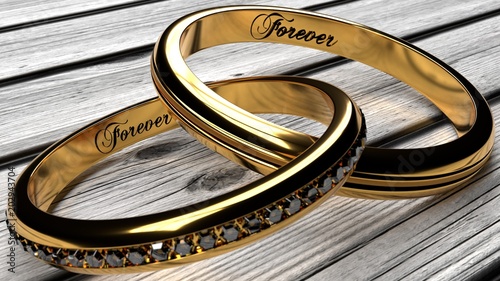 Forever together in marriage or relationship - two joined, inseparable golden rings with a word 'forever' engraved inside, macro close up, on a white worn wooden table  