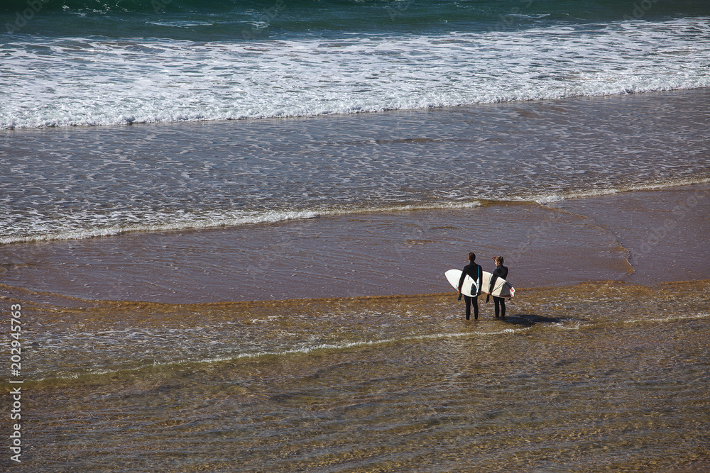 Silhouette of surfer people carrying his surfboard. Silhouette of surfer people carrying his surfboard.