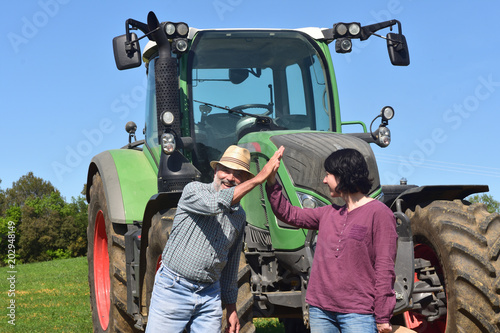 couple of farmers looking at a field