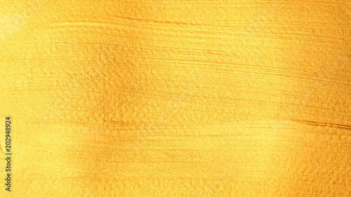 Gold colored poster watercolor for an abstract background.
