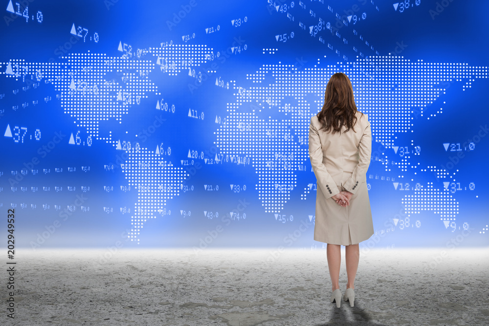 Φωτογραφία Rear view of businesswoman against global stocks and shares graphic