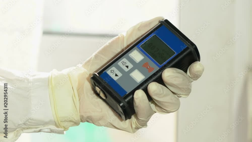 Man checking radiation with geiger counter Man checking radiation with geiger counter