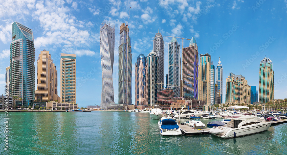 DUBAI, UAE - MARCH 24, 2017: The skyscrapers of Marina and the yachts.