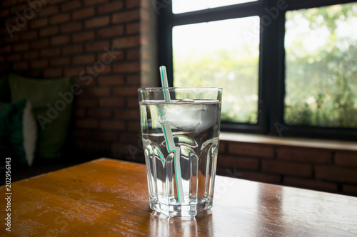 glass of mineral water on wood table in restaurant