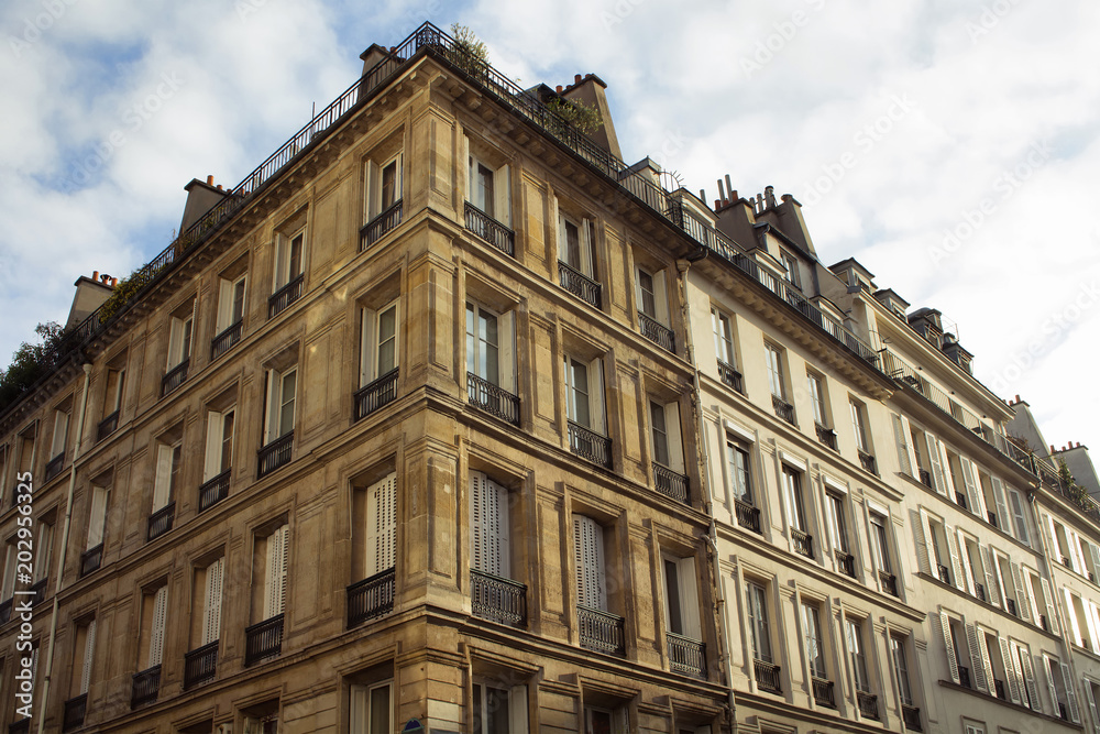 View of a building in Paris showing French / Parisian architectural style in sunset.