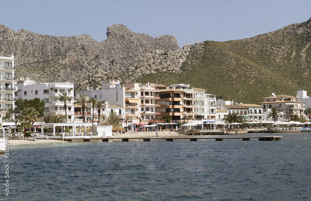 Port of Pollenca, Mallorca, Spain. 2018.  Shops, apartments and hotels overlookingBay of Pollensa.