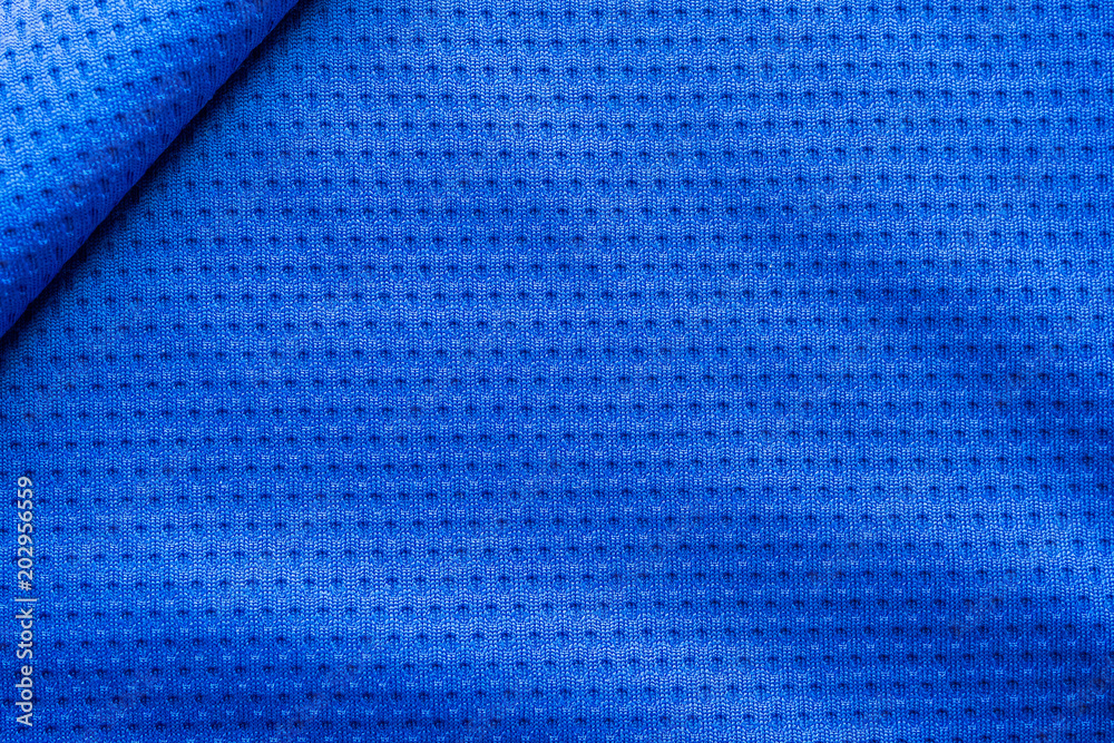 Fototapeta premium Blue color fabric sport clothing football jersey with air mesh texture background