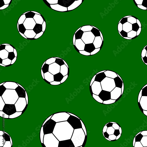 Seamless pattern of big soccer balls on green background