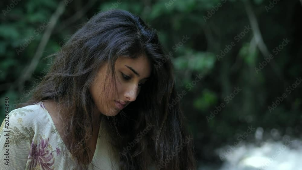 portrait of sad woman crying in the forest portrait of sad woman crying in the forest