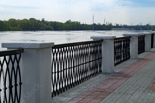 Fence on the embankment of the river