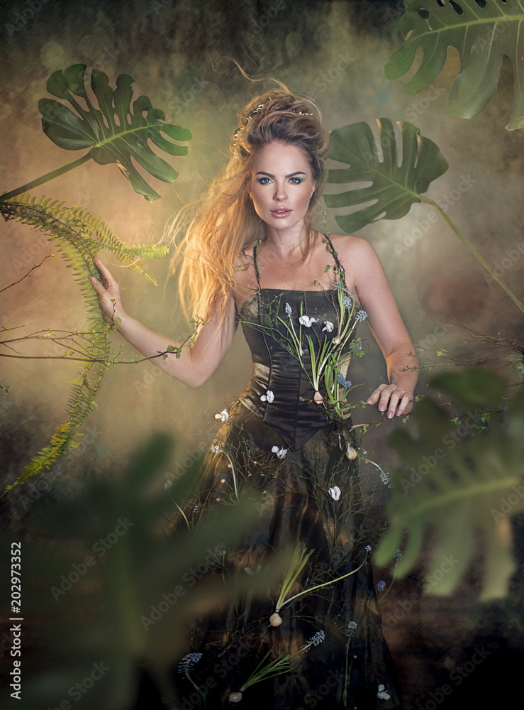 Fabulous forest nymph with long hair and green dress Stock Photo | Adobe  Stock