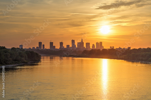 Evening panorama of Warsaw skyline over Vistula river at sunset  Poland
