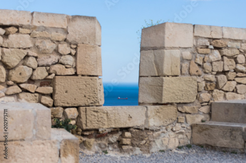 Landscape view from the top of the Castle of Santa Barbara in the background the beaches of the beautiful city of Alicante, Spain