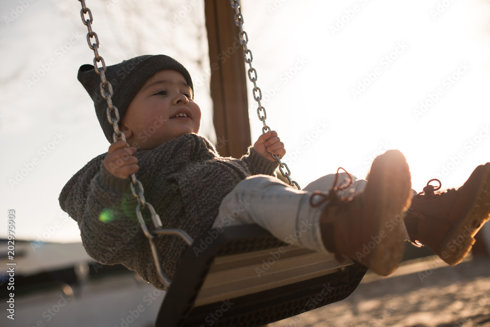 Fotografie Toddler on a swing seat