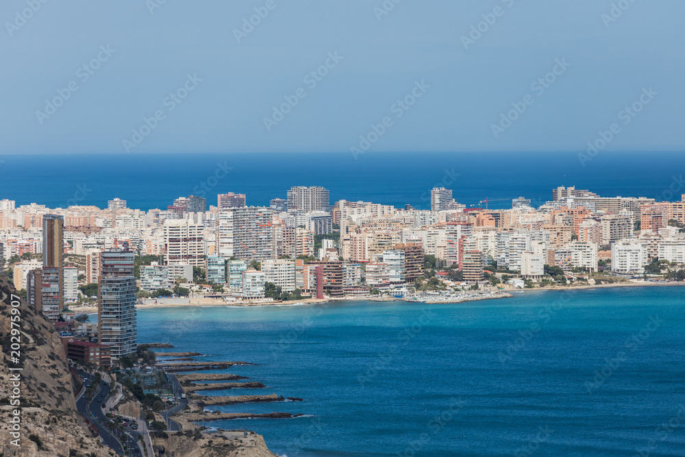 Landscape view from the top of the Castle of Santa Barbara in the background the beaches of the beautiful city of Alicante, Spain
