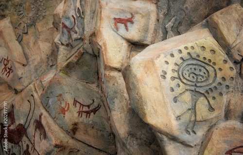 Petroglyps on the stone photo