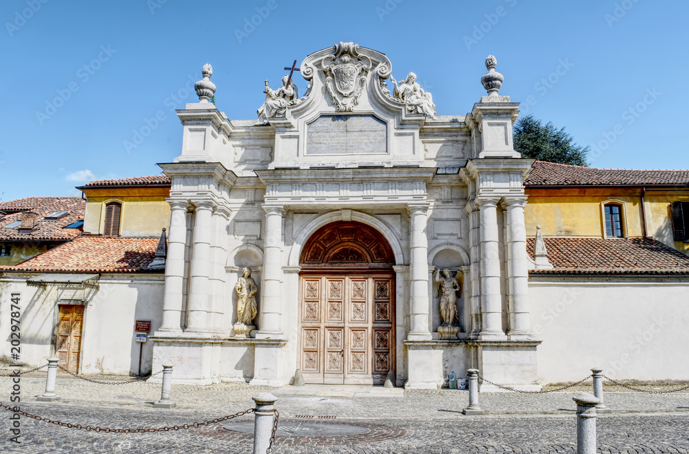 Main entrance of the white Certosa of Collegno, Italy. HDR effect.