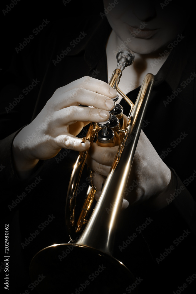 Obraz premium Trumpet player. Trumpeter playing jazz instrument