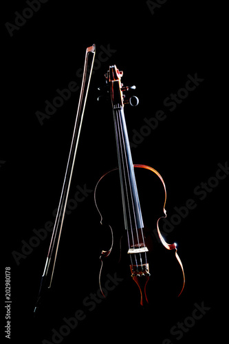 Violin isolated on black. Violin and bow