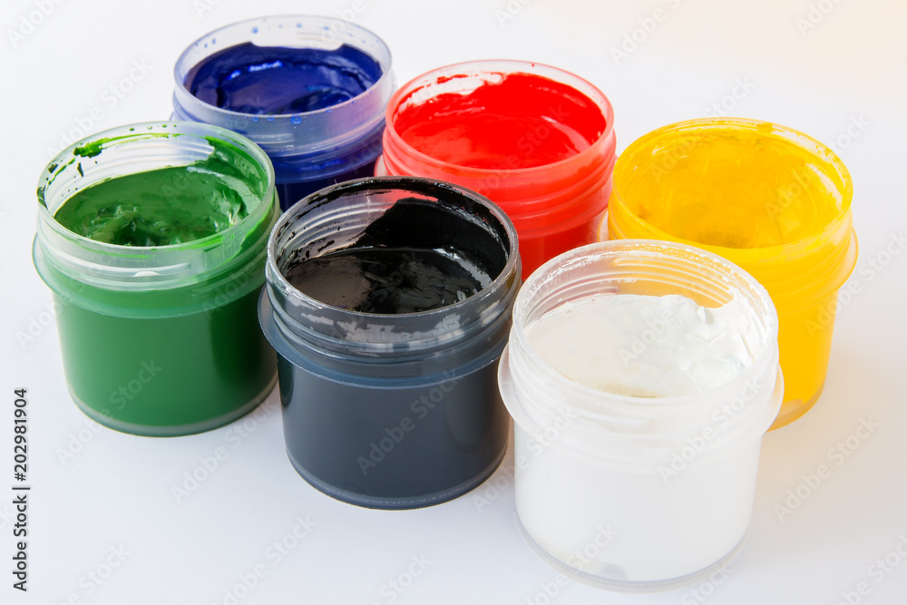 Colored gouache jars on white background. Side view Colored gouache jars on white background. Side view