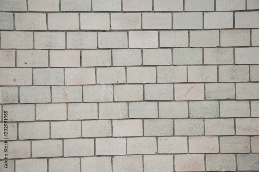 Textured background. White brick wall