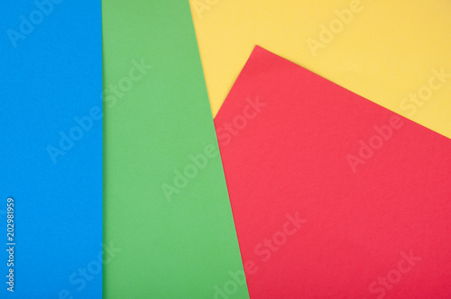 Colored background. Blue, green, red, yellow paper