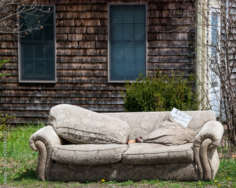 Old sofa for sale on street in front of abandoned building Stock Photo |  Adobe Stock