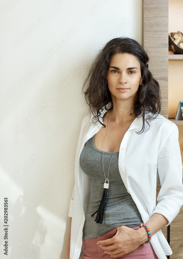 Portrait of stylish adult woman at home