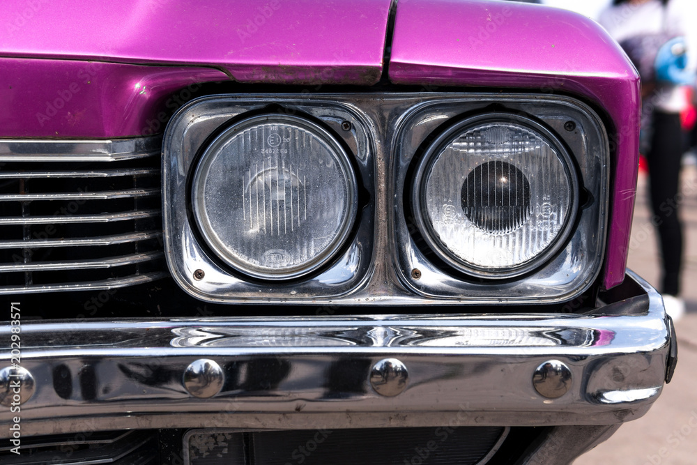 close up of headlight parts classic purple car retro vintage style