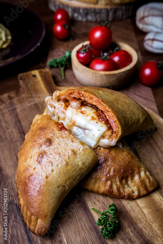 pizza puff set on dinner table.