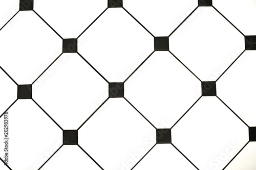 Elements of interior. Stylish black and white tiles. Close-up
