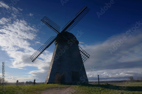 Working windmill, it was built in Europe. Dark sky background.