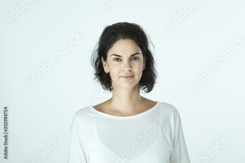 Portrait of casual smiling woman on white