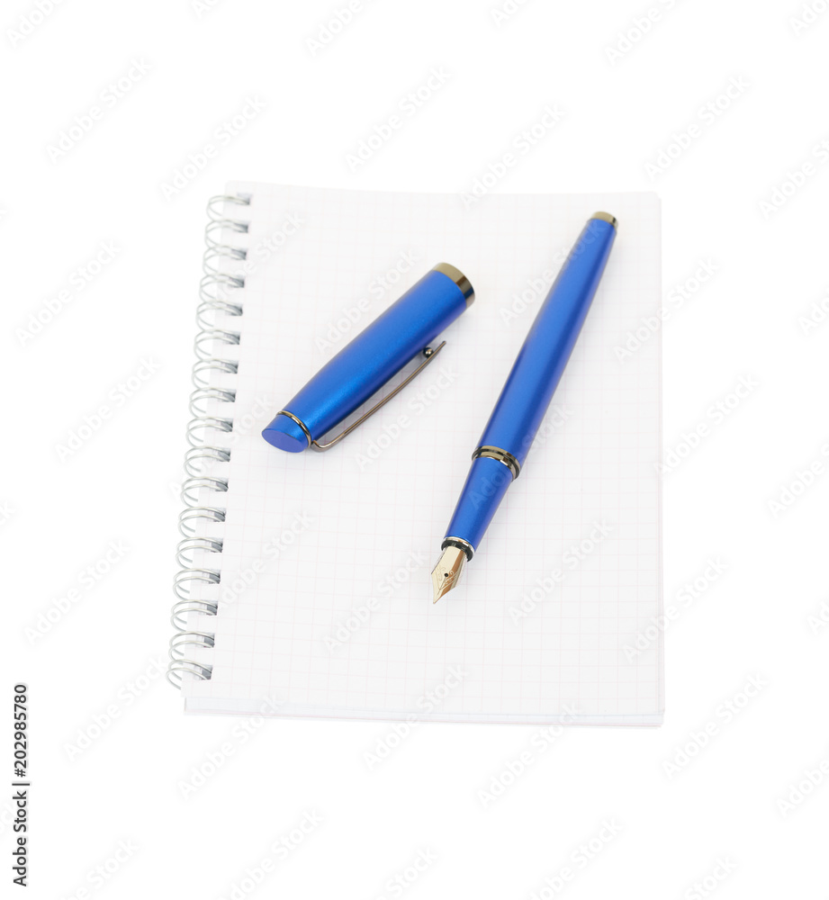 Fountain pen and spiral notebook isolated on white background. Fountain pen and spiral notebook isolated on white background.