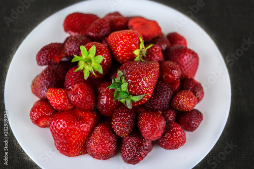 ripe berry strawberry clouse-up for the background.