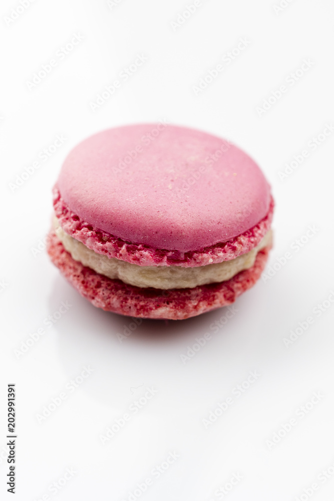 Sweet raspberries macarons isolated on white background. Sweet raspberries macarons isolated on white background.
