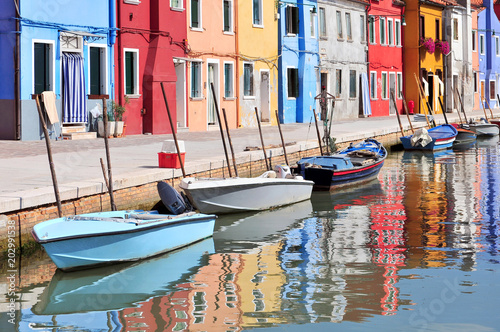 Small colored houses and the boats in sunny summer day, Venice Burano island. © GISTEL