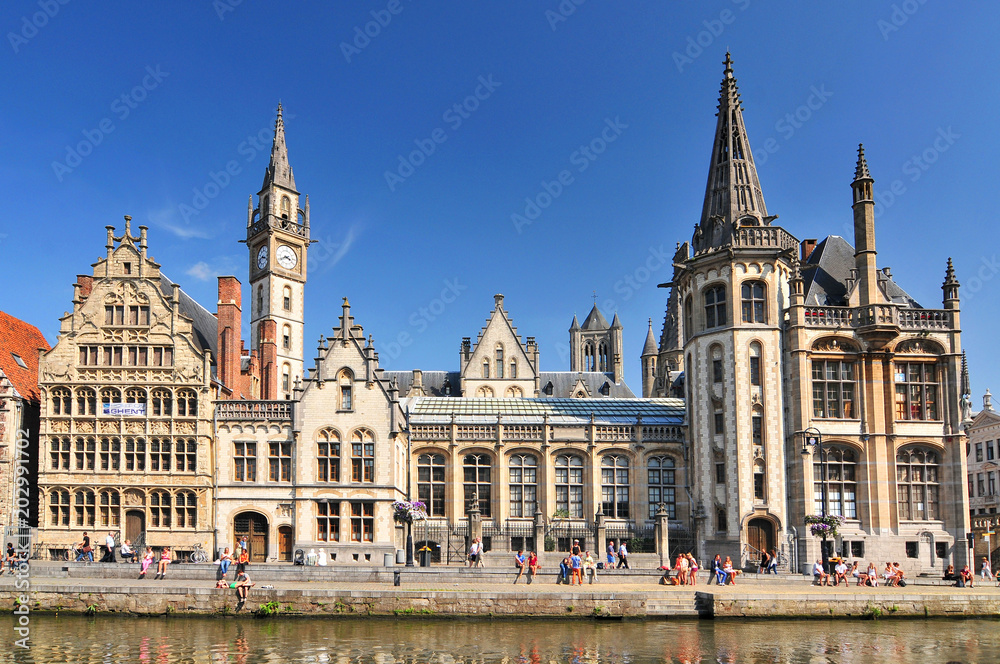 Picturesque medieval buildings overlooking the Graslei harbor on Leie river in Ghent town Belgium Europe.