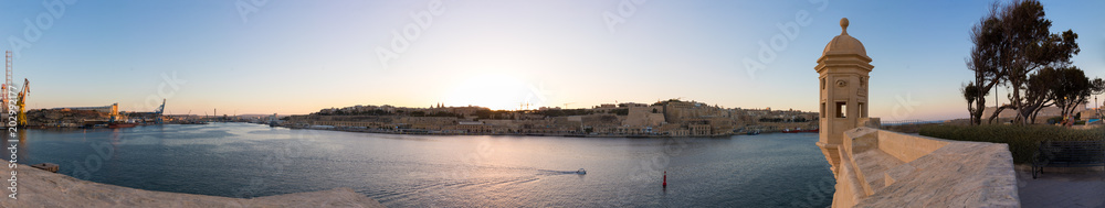 High Resolution Panorama of the beautiful limestone ancient traditional watch tower at Gardjola Gardens, Il-gardjola in Maltese, overlooking the Grand Harbour and Valletta, Senglea, Malta, June 2017