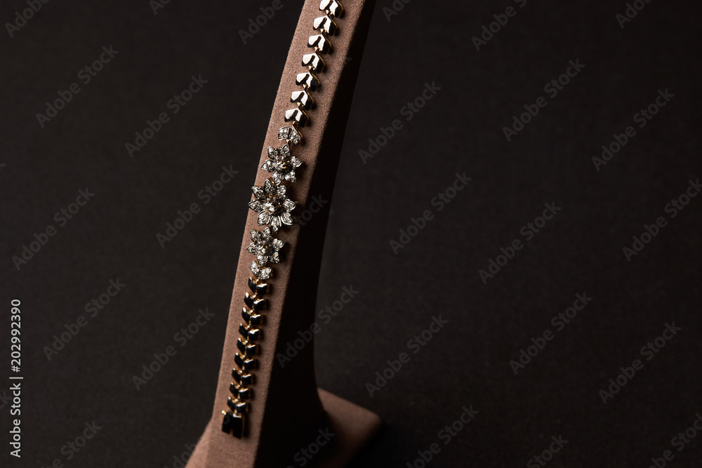 Obraz premium Diamond Women's Wristband. Beautiful luxury bracelet jewellery with gemstone diamonds, close-up. Selective focus