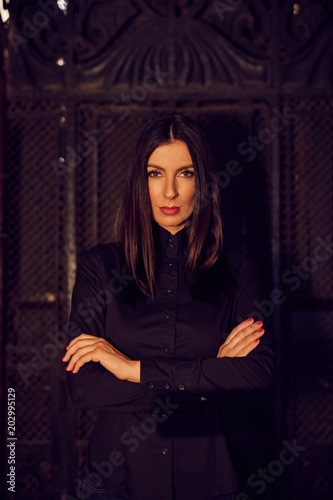 Fashion photo of trendy woman in black shirt