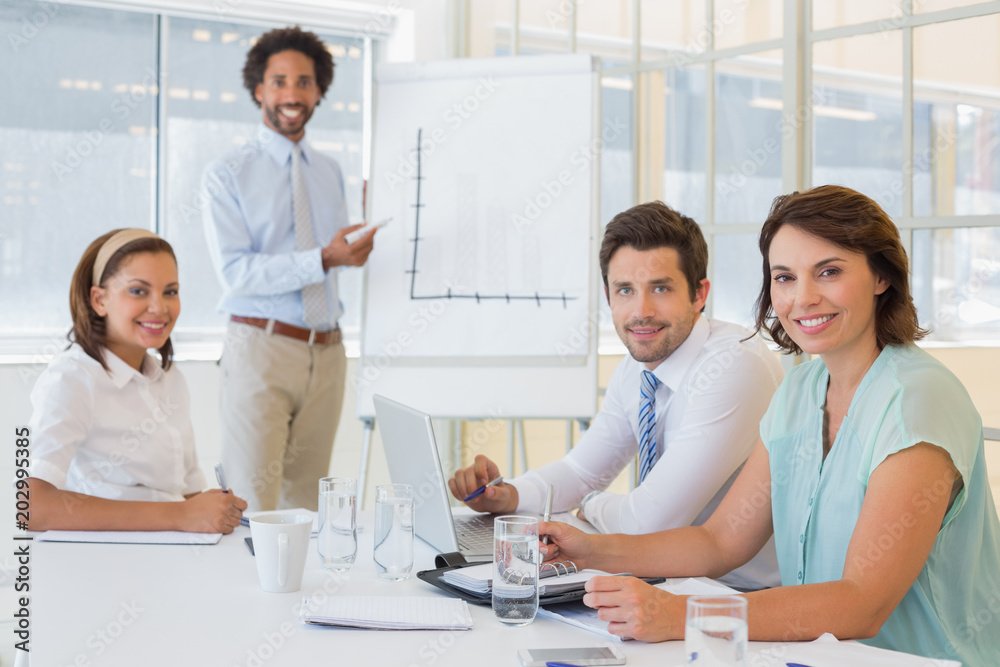 Fototapeta premium Businessman giving presentation to colleagues in office