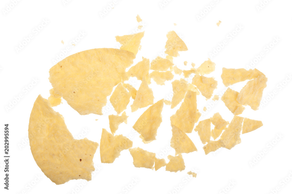 Potato chips crumbs and leftovers isolated over the white background