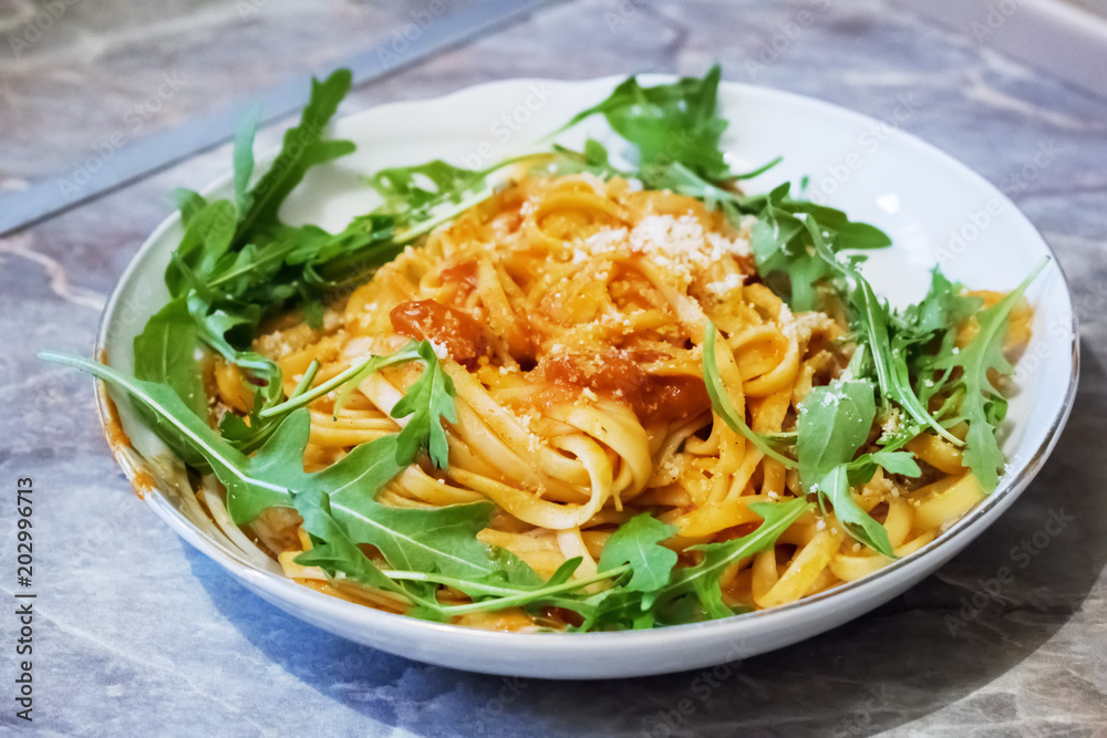 Spaghetti with tomato sauce on the wooden table Spaghetti with tomato sauce on the wooden table