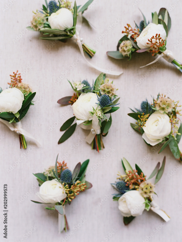 Close-up of boutonniere randomly place on white background Close-up of boutonniere randomly place on white background